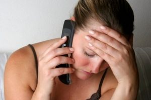 Woman on the Phone Receiving Bad News