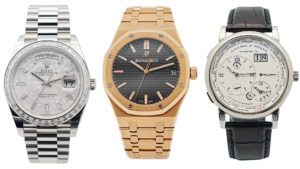 Drei Uhren: links: Rolex Day Date 40 aus 950er Platin, mitte: Audemars Piguet Royal Oak, rechts: A. Lange & Söhne Lange 1 „Time Zone“