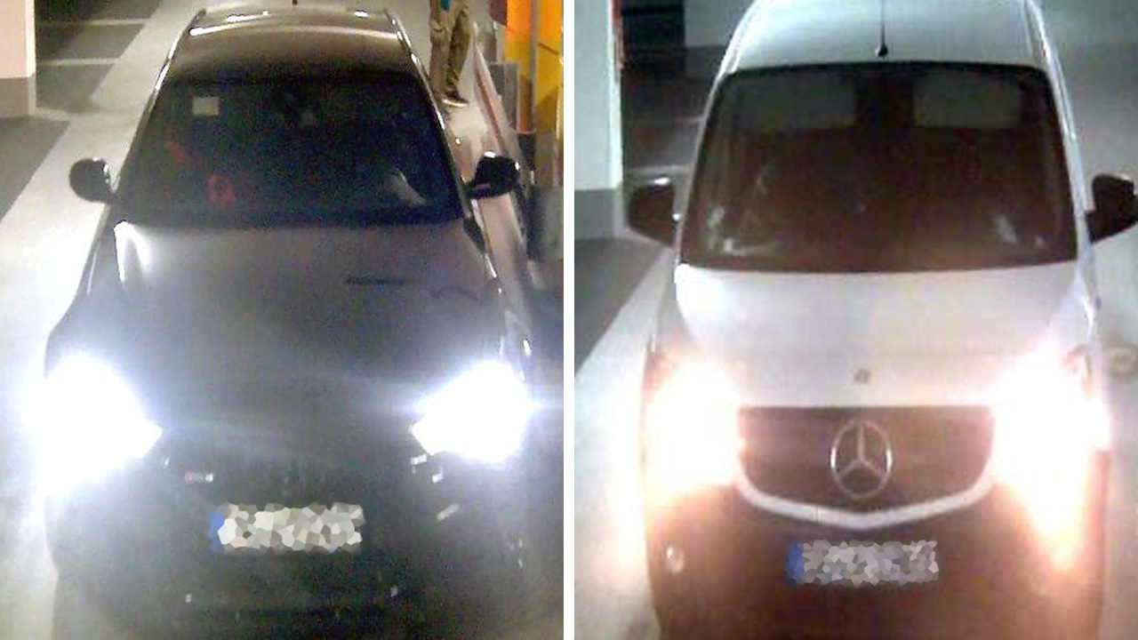 Ein dunkler Audi und ein weißer Transporter